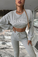 Load image into Gallery viewer, Graphic Dropped Shoulder Cropped Top and Stacked Pants Set
